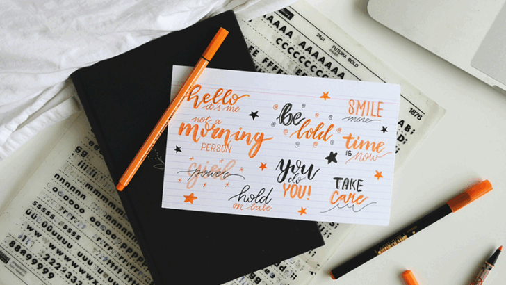 Illustration of a designer drawing on a sketchbook next to the title “Unique Hand-Drawn Fonts That Add Personality to Your Design”, used as a blog cover about hand-drawn typography.